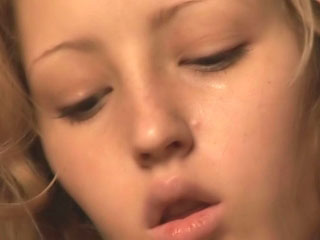 Adorable blonde teen stripping and fingering wet pussy